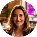 Jamaleddine Trani, a confident female professional in a Rome cafe, smiling after a successful interview